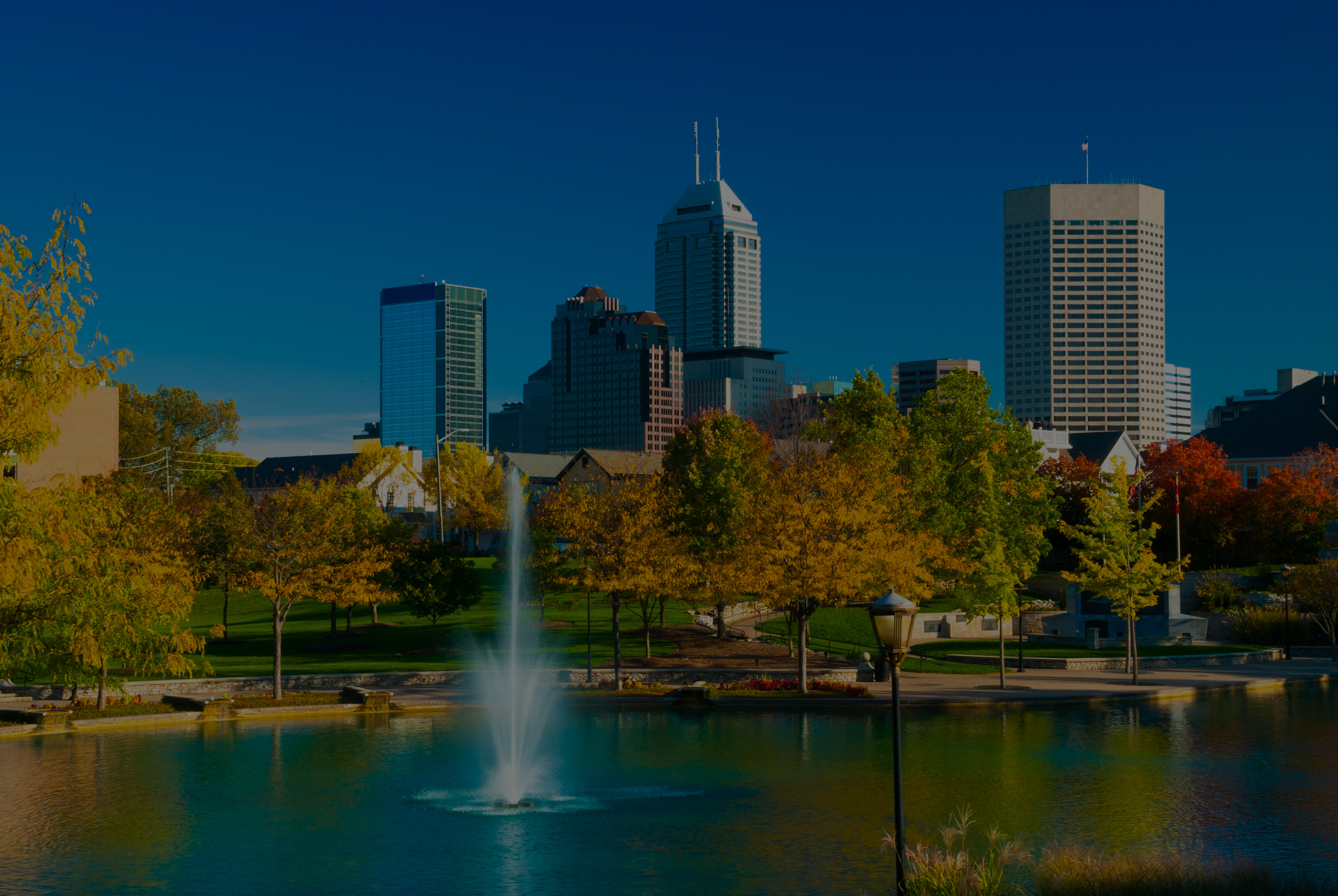 Indianapolis skyline with a fountain and park during autumn
